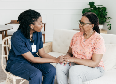 Social care worker taking care of an elderly person